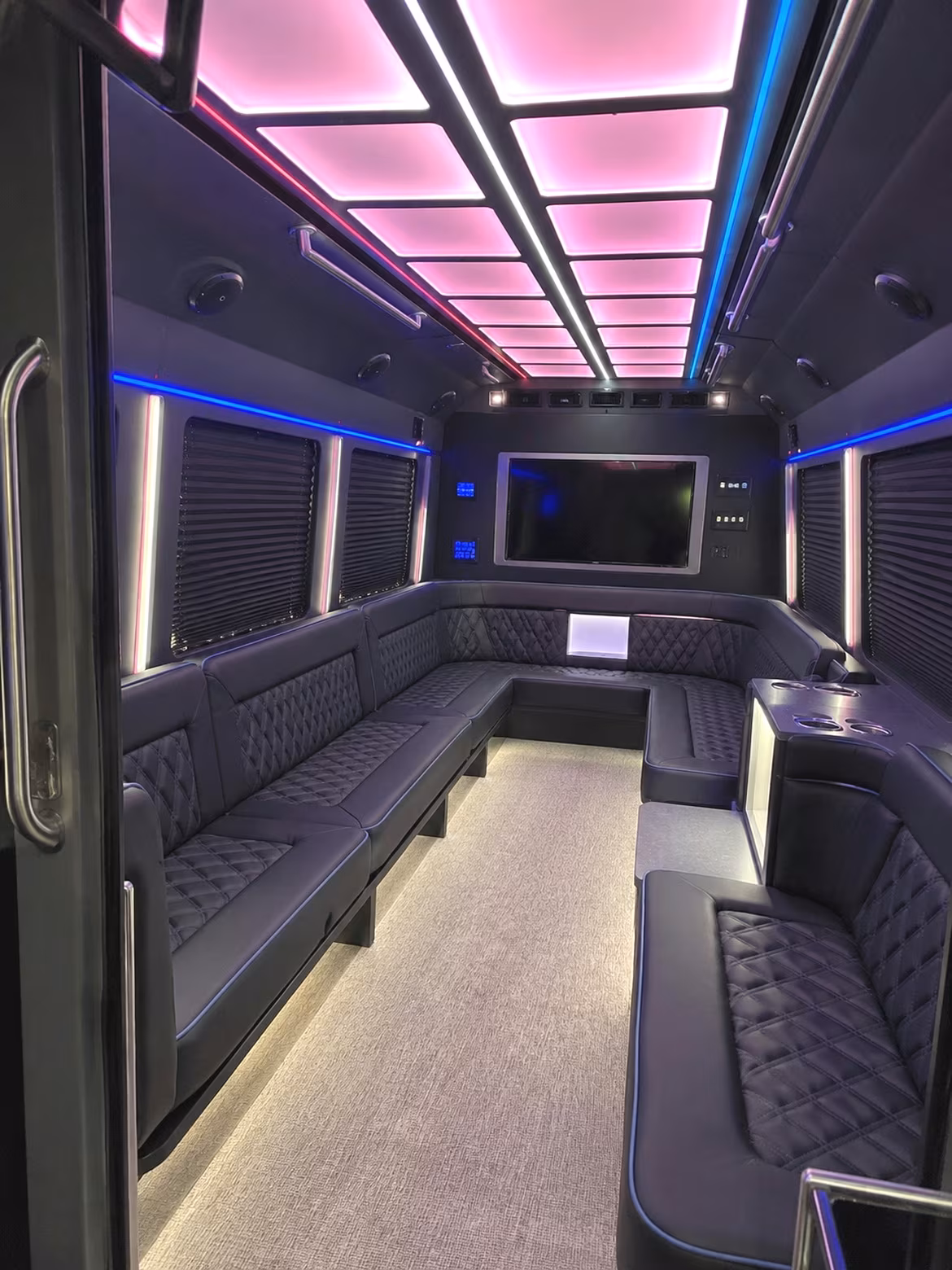 Group beside a Mercedes Sprinter limo in Topeka